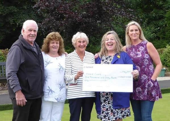 A cancer charity has been bowled over with a generous donation in memory of a popular Sabden man