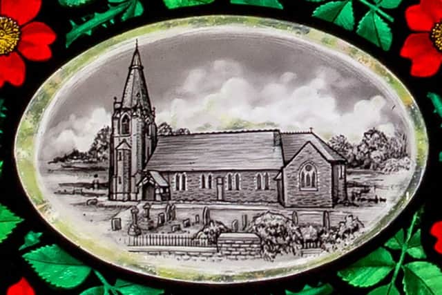 The roundel depicting St John's Church at Read.