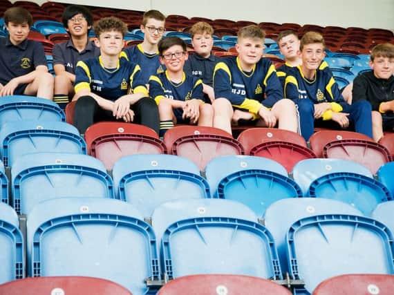 Students from Blessed Trinity RC College prepare for their seatt swap challenge at Turf Moor.