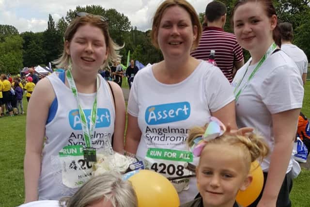 Lily-Mae with her big sister Hollie, great aunt Kay McKenny and friends Liz Nelson and her daughters Hannah and Heather after the Burnley 10k.