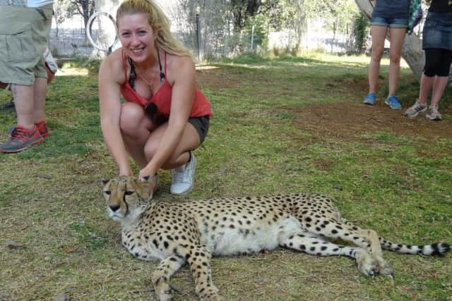 Festival guru Lindsay Atkinson gets up close and personal with a cheetah in Namibia.