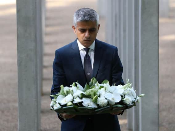 Mayor of London Sadiq Khan lays flowers during a service for the 12th anniversary of 7/7 attack.