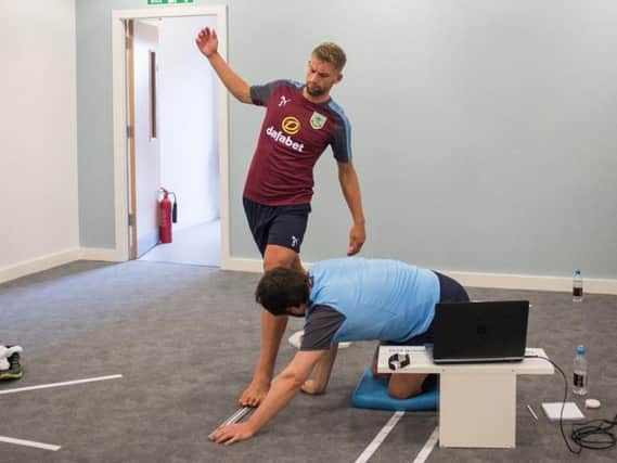 Charlie Taylor undergoes testing at Gawthorpe. Photo: Burnley FC / Andy Ford