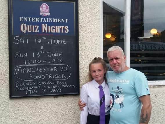 Paul Robinson, landlord of the Shakespeare pub in Padiham with his youngest daughter Savannah.