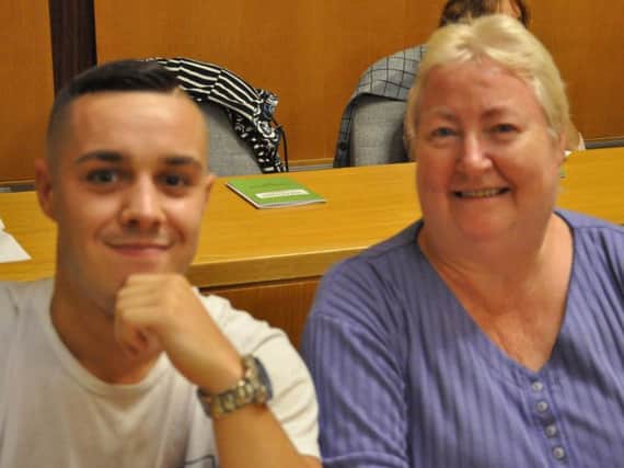 Ex-convict Sam, pictured with volunteer Patricia, gave a talk about the role of a Samaritans listener in prison at the charity's AGM. (s)