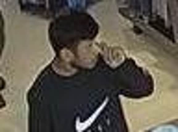 Police are keen to trace this man in connection to a shoplifting incident at the Burnley Football Club shop