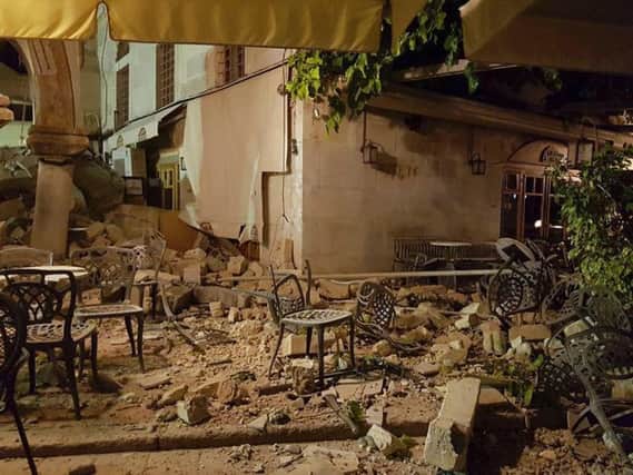 A cafe setting is littered with rubble following a strong earthquake on the Greek island of Kos