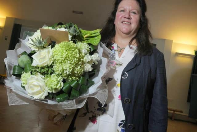 Teacher Mrs Anne Battersby with flowers she was presented with on her last day at Ightenhill Primary School in Burnley.