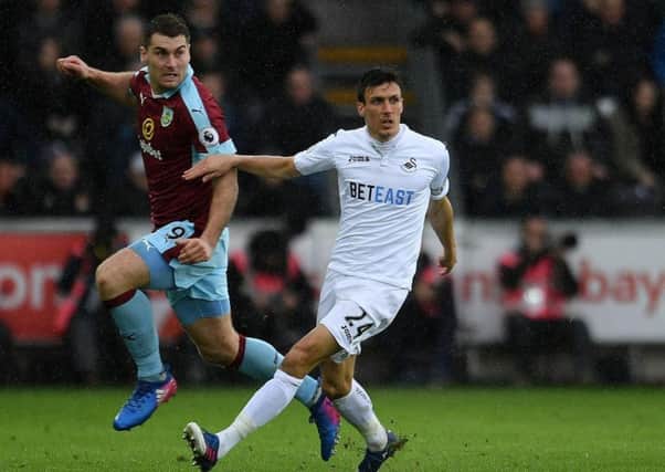 Sam Vokes battles for the ball with Jack Cork