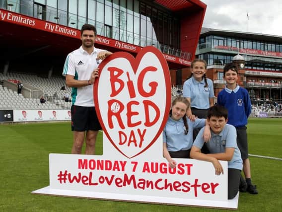 Anderson with youngsters supporting Old Trafford charity initiative