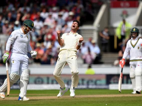 Englands James Anderson celebrates taking the wicket of South Africas Dean Elgar