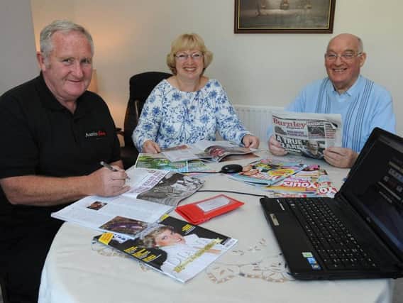 Burnley and District Talking Newspaper volunteers Alan Dunderdale (left) his wife Marjorie and Brian Horne, prepare the next edition for listeners