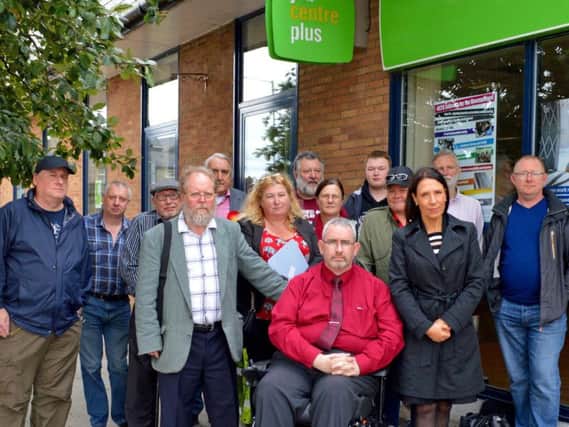 Demonstrators including Shadow Secretary of State for Work and Pensions Debbie Abrahams MP with residents and activists at Colne Jobcentre
