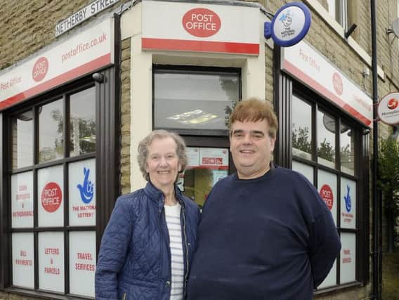 Barbara Atkinson and son Peter Harrison outside the Post Office on Coal Clough Lane. (s)