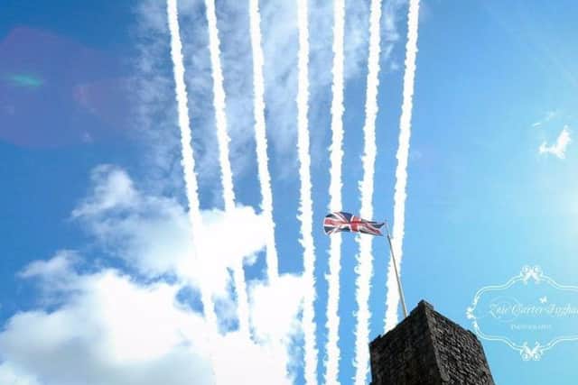 The vapour trail of the Red Arrows over Clitheroe