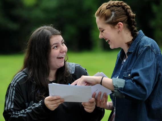 Victoria Stanworth (left) and Darcy Hill are thrilled with their A'level results at Thomas Whitham Sixth Form in Burnley.