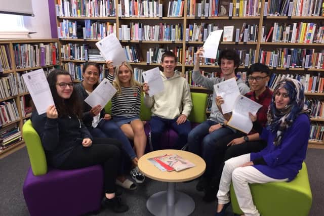 Clitheroe Royal Grammar School Sixth Form Centre A Level students Chloe Wilson, Sophie Clark, Amy Jones, Alastair Patefield, James Kelly, Erl Lampa and Taiba Nasir celebrating after receiving their results.