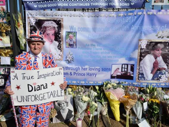 Royal fan Terry Hutt amongst tributes to mark the twentieth anniversary of the death of Diana, Princess of Wales, outside Kensington Palace, in London