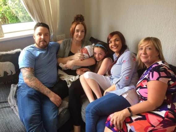 Baby Monty with his mum, Katie Guest, dad Chris Whittaker, big sister Tilly (seven) auntie Claire Whittaker and grandma Diane Waite