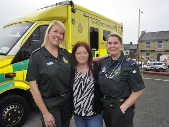 Mel Moon meets Sam Mawdsley (right) and Karen Batley, the paramedics who saved her life when she suffered a  massive heart attack.