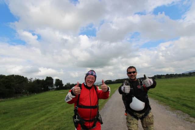 John gives the thumbs up before his tandem skydive with instructor Chris Davies
