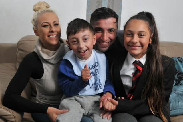 Tariq Khan, who was inspired to launch a mercy mission after meeting the family of a boy in Turkey, who has the same condition as his son Kalam (pictured) with his wife Kirsty and daughter Sophia