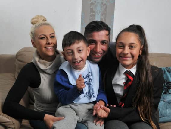 Tariq Khan, who was inspired to launch a mercy mission after meeting the family of a boy in Turkey, who has the same condition as his son Kalam (pictured) with his wife Kirsty and daughter Sophia