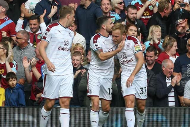 Scott Arfield celebrates his opener against Liverpool at Anfield