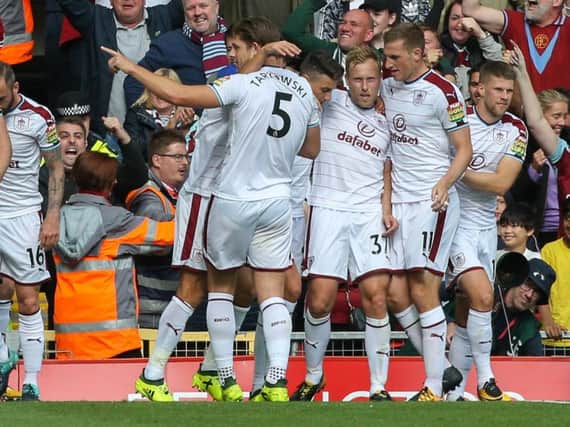 Scott Arfield is mobbed following his goal