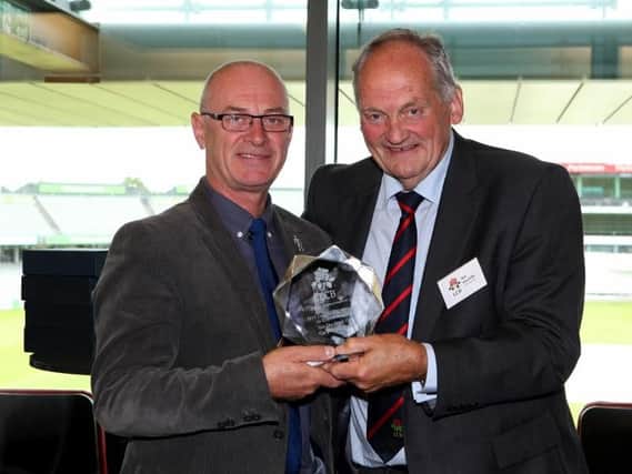 Gary OConnor (left) receives his award at Emirates Old Trafford from Bob Hinchliffe (Chairman of the LCB).