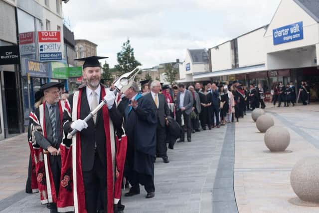 The UCLan graduates procession through Burnley town centre to the Mechanics Theatre, was quite a spectacle.