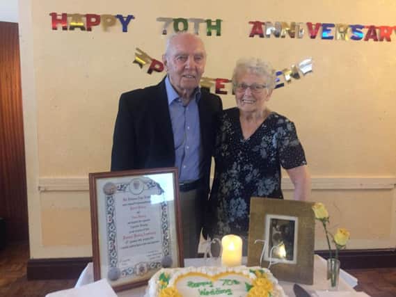 Patrick and Eileen Fleming, who are celebrating 70 years of marriage, with a framed certificate sent to them as a blessing from the Pope. (s)