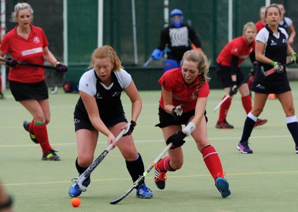Pendle Forest Hockey Club (red) v Lytham Hockey Club at Marsden Heights Community School, Nelson. Olivia Bythell in action. Picture by Paul Heyes, Saturday March 12, 2016.