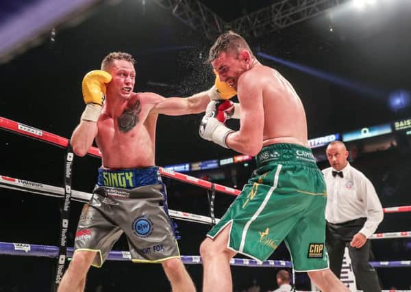 Shayne Singleton (left) catches Peter McDonagh with a left hook during their fight at the Manchester Arena                                                  Picture: Karen Priestley