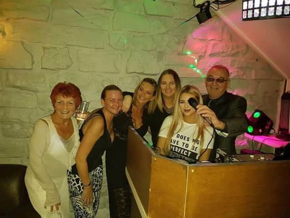 DJ Pat Carter with friends and family at his farewell gig.