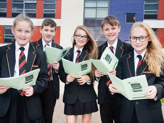 Five of the six students, Leo Cassidy, Tegan Green, Ashleigh Capstick, Kendal Hankinson and Daniel Thomson, with their literacy passports and prizes for completing work over the summer holidays.