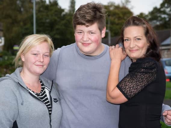 Sea rescue heroes Ben Ashworth and Charlotte McIntyre with Ben's mum, Sarah Oxborough.