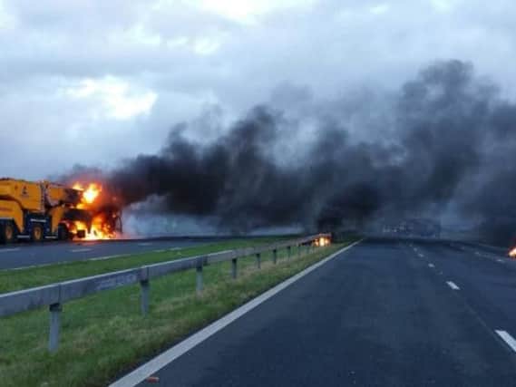 The motorway has been closed following a crane fire