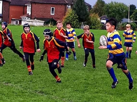 Youngsters from Burnley RUFC in action against Bury