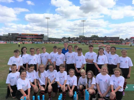 Pupils and teacher, Abigail Bates, from Shuttleworth College at the ICC Womens Cricket World Cup game between England and New Zealand.