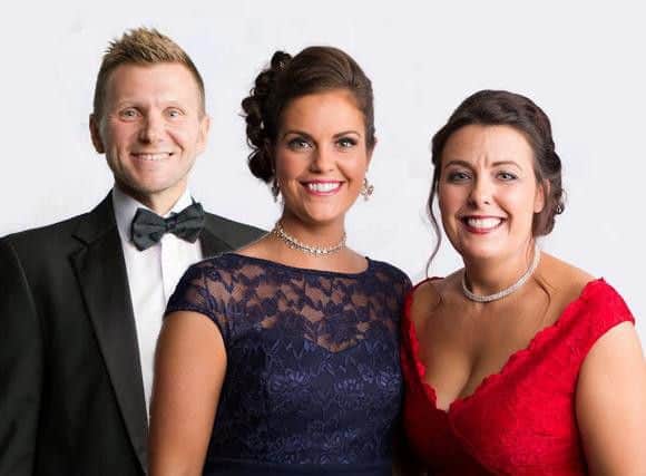James Young, Aimee Gannon and Donnamarie Sturrock, of Alexander Grace Law, have raised 13,000 at their first charity ball.