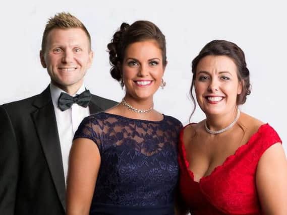 James Young, Aimee Gannon and Donnamarie Sturrock, of Alexander Grace Law, have raised 13,000 at their first charity ball.