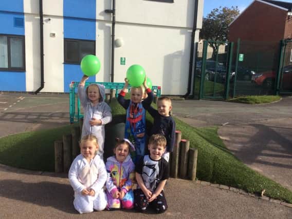 Looking cute and comfy in their PJs and onesies are some of the children at Whitegate Nursery School in Padiham, who stage the day to raise funds for the Manchester Children's Hospital.