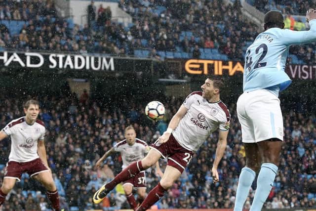 Stephen Ward in action against Manchester City