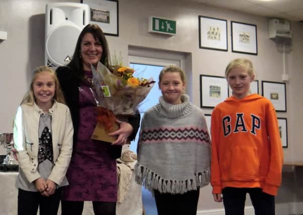 Deputy Mayoress Cllr Sarah Rainford accepts flowers from  Molly Durnell (Longridge CC), Lucy Rawson and Ruth Harbord (Salesbury CC).