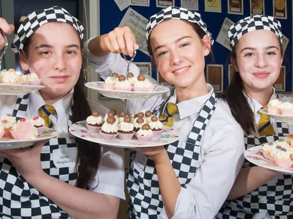 Sarah Jones, Louisa Capstick and Eleanor Sutherland make sure all is sweet in hospitality and catering at Blessed Trinity's open evening
