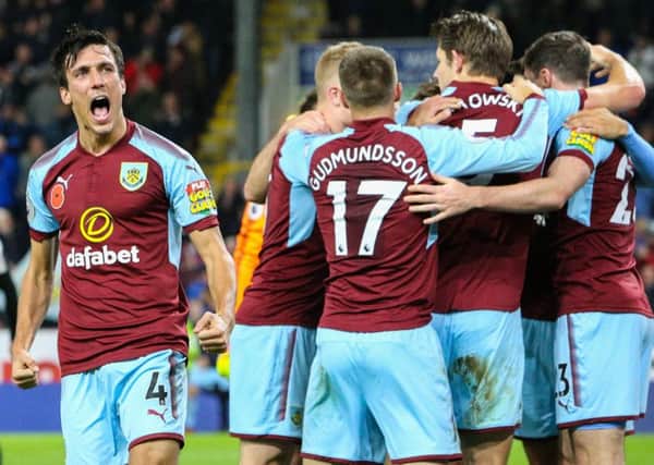 Jack Cork and the rest of the Burnley team celebrate Jeff Hendrick's goal

against Newcastle United on Monday night.