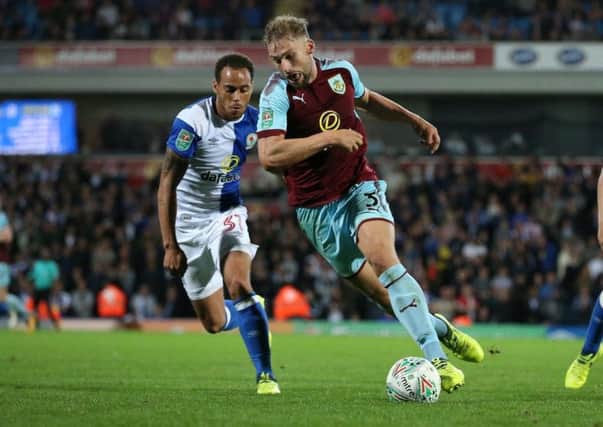 Charlie Taylor in action for the Clarets against Blackburn in the Carabao Cup