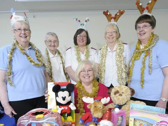 Pictured at the launch to this year's Christmas Toy Appeal at the Salvation Army citadel in Burnley are (back, left to right)   Janet Raven, Jean Steele, Cpt Maisie Veacock, Major Ann Silcock, Christine Hunt and (front) Burnley Express reporter Sue Plunkett.