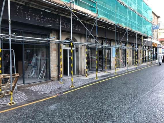 The former Burnley Express office in Bull Street is being renovated into four shops and 13 apartments.